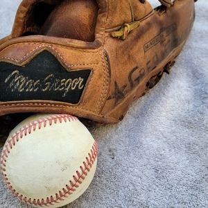 Vintage MacGregor leather baseball glove and hardball.